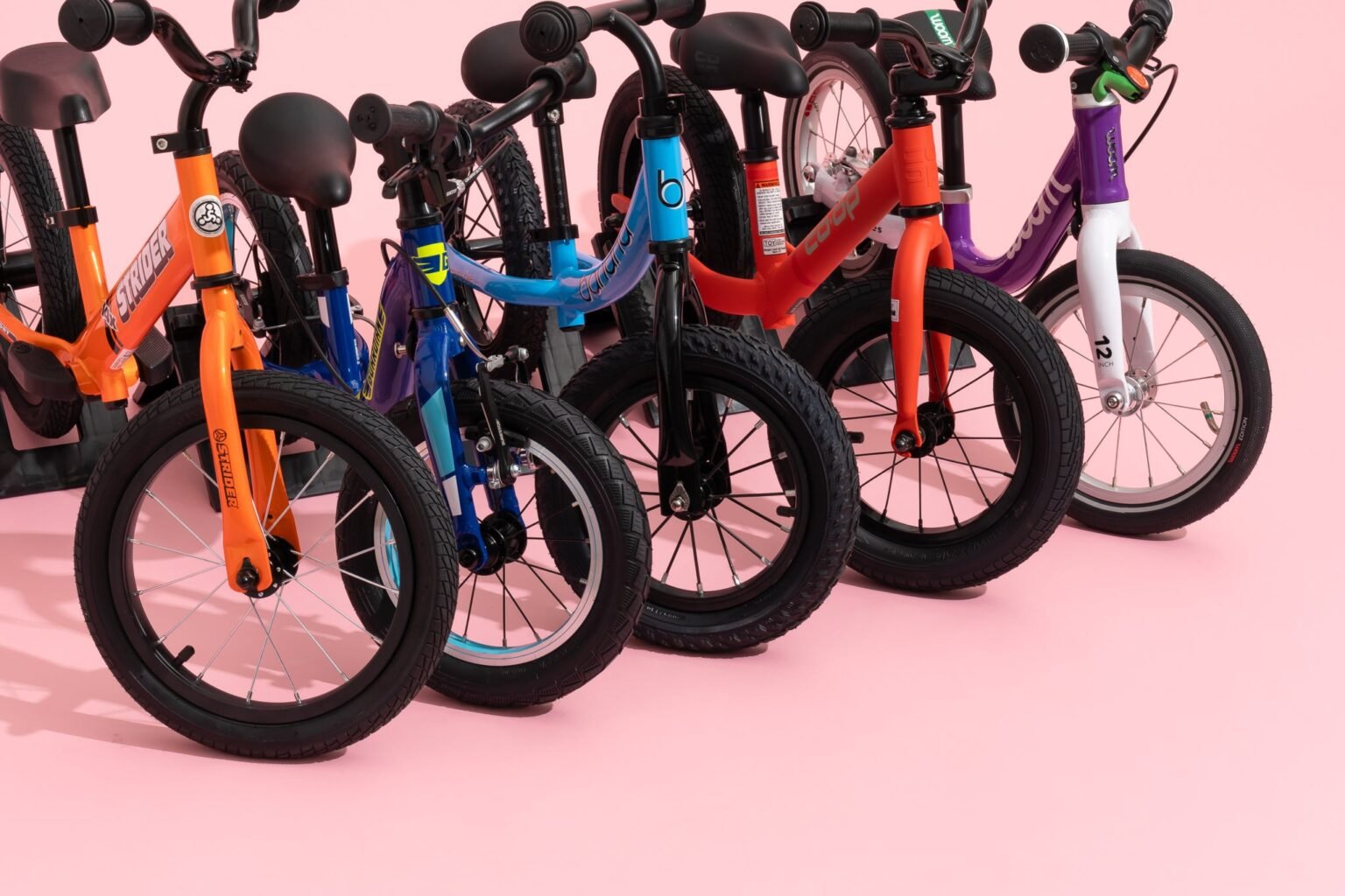 Promotional banner displaying balance bikes for sale on Planet of Bikes